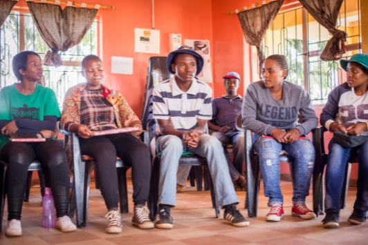 beneficiaries sitting together learning