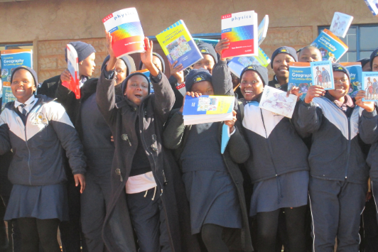 kids with books smiling
