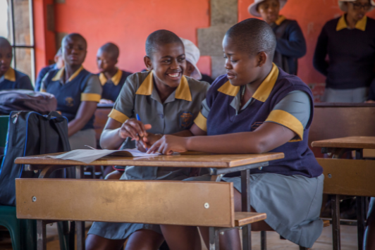 girls in classroom laughing