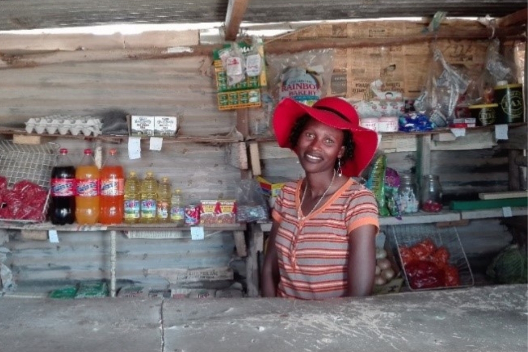 Young mother in Lesotho in her tin shop